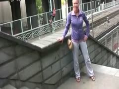 In a park, Irina changes her clothes and urinates in her underwear.